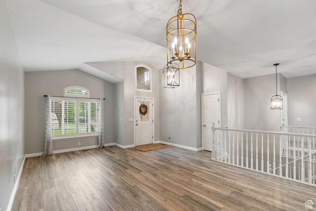 311 E Edgemont Dr S, North Salt Lake, UT 84054 - entrance foyer featuring a chandelier, lofted ceiling, and wood finished floors