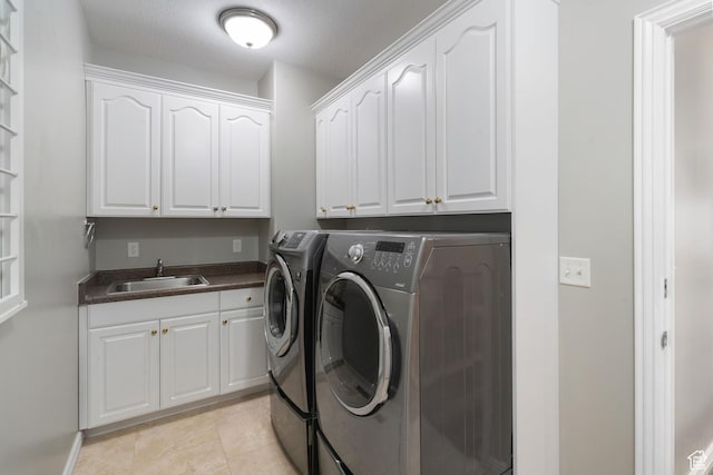 311 E Edgemont Dr S, North Salt Lake, UT 84054 - washroom with washer and clothes dryer, cabinet space, and light tile patterned floors