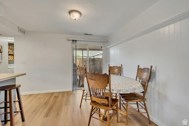 1517 S 700 W, Woods Cross, UT 84087 - dining space featuring light wood-style floors and washer / dryer