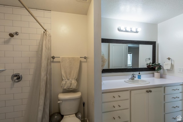 69 W 2200 S, Kaysville, UT 84037 - full bathroom featuring vanity, a textured ceiling, and tiled shower