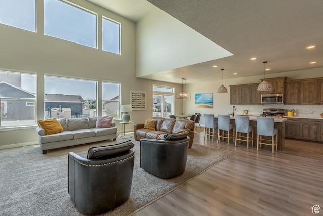 69 W 2200 S, Kaysville, UT 84037 - living room with wood finished floors, healthy amount of natural light, recessed lighting, and a towering ceiling