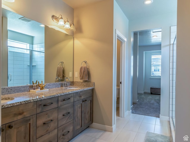 69 W 2200 S, Kaysville, UT 84037 - full bath with double vanity, healthy amount of natural light, tile patterned floors, a stall shower, and recessed lighting