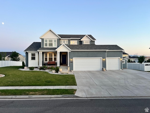 69 W 2200 S, Kaysville, UT 84037 - view of front facade featuring an attached garage, covered porch, and driveway