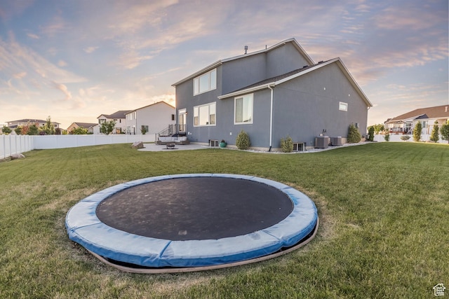 69 W 2200 S, Kaysville, UT 84037 - back of house with a trampoline and stucco siding