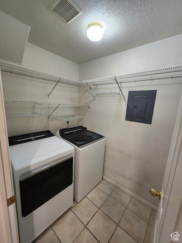 1132 W 1390 S, Orem, UT 84058 - washroom with electric panel, washer and dryer, light tile patterned floors, and a textured ceiling