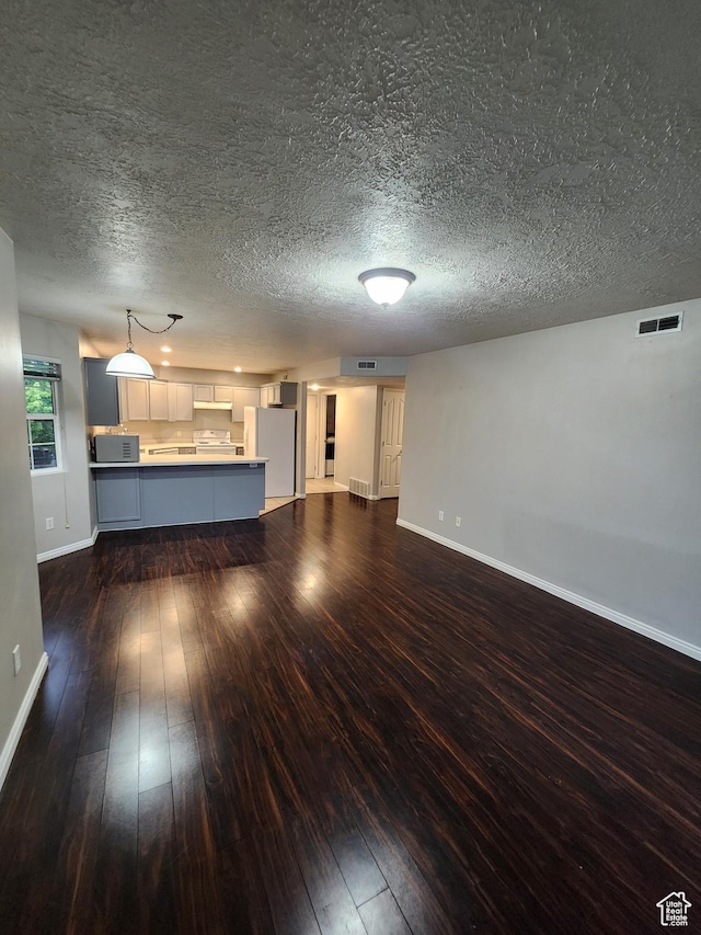 1132 W 1390 S, Orem, UT 84058 - unfurnished living room with dark wood-style floors and a textured ceiling
