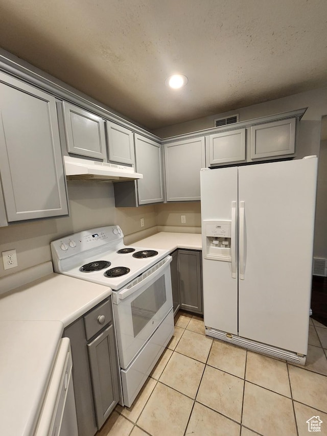 1132 W 1390 S, Orem, UT 84058 - kitchen with white appliances, gray cabinets, under cabinet range hood, light countertops, and light tile patterned flooring