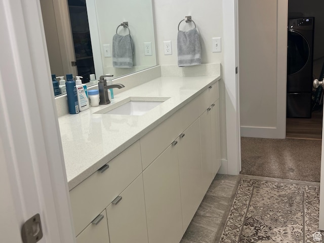3589 S Xenon Dr W, West Valley City, UT 84119 - bathroom featuring washer / dryer and vanity
