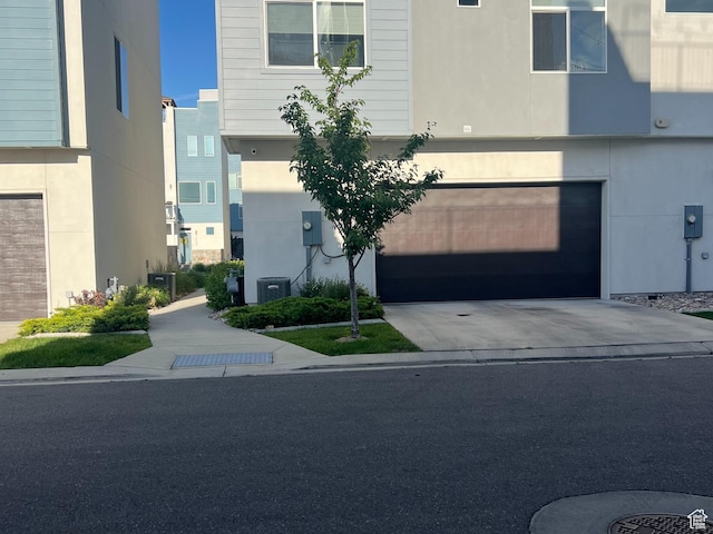 3589 S Xenon Dr W, West Valley City, UT 84119 - view of front facade featuring a garage and driveway