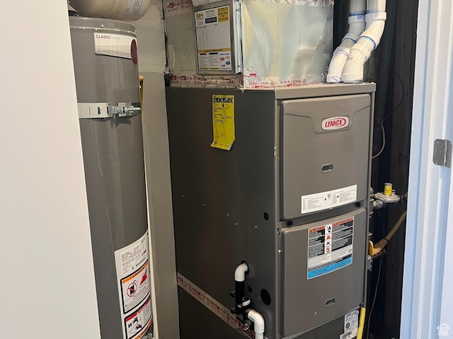 3589 S Xenon Dr W, West Valley City, UT 84119 - utility room featuring water heater and heating unit