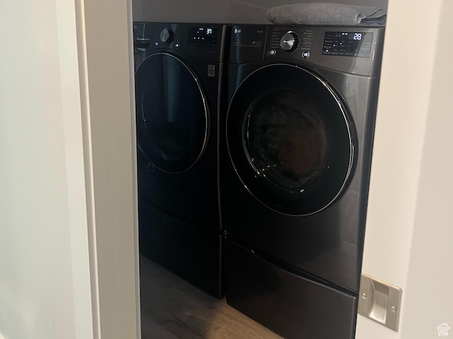 3589 S Xenon Dr W, West Valley City, UT 84119 - laundry room with separate washer and dryer and wood finished floors