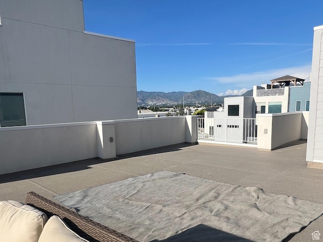 3589 S Xenon Dr W, West Valley City, UT 84119 - view of patio / terrace with a mountain view