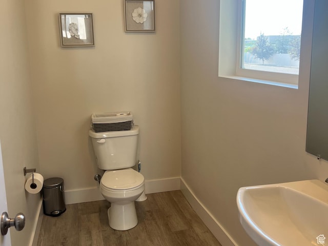 3589 S Xenon Dr W, West Valley City, UT 84119 - bathroom featuring wood finished floors and toilet