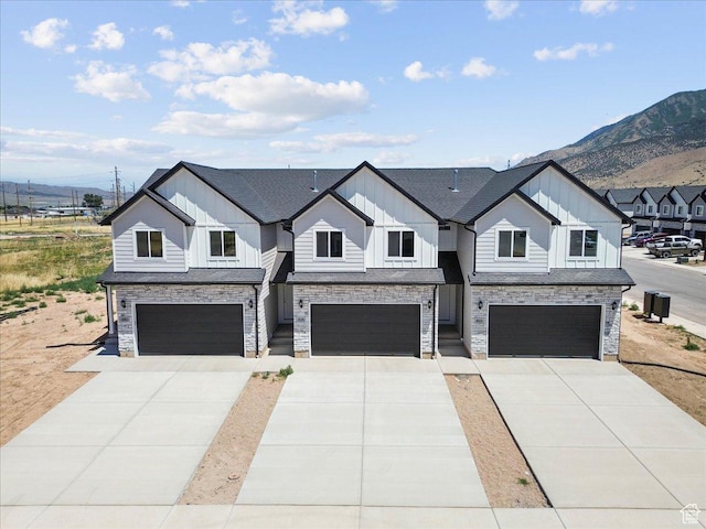 217 W 815 N Unit 20, Nephi, UT 84648 - modern farmhouse style home featuring board and batten siding, a garage, a mountain view, and concrete driveway