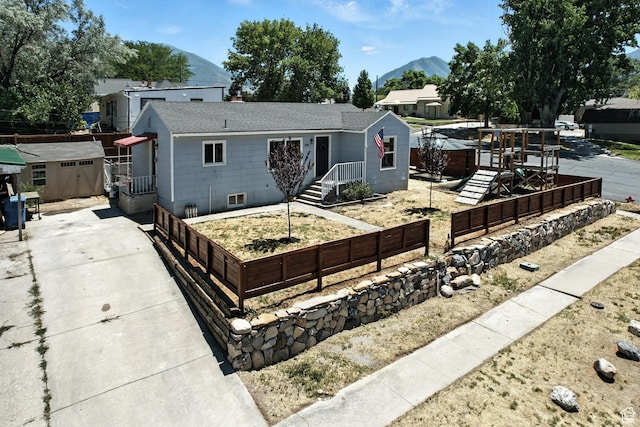 291 S 700 E, Spanish Fork, UT 84660 - single story home with a mountain view, a storage unit, a shingled roof, and concrete driveway