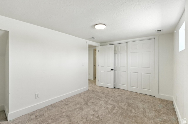 291 S 700 E, Spanish Fork, UT 84660 - unfurnished bedroom featuring light carpet, a closet, and a textured ceiling