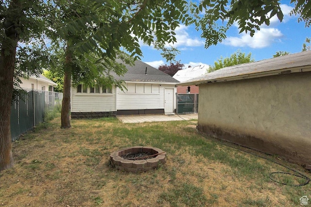 3241 Grant Ave, Ogden, UT 84401 - view of yard featuring an outdoor fire pit