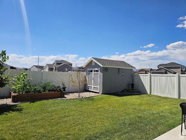 826 S 300 W, Vernal, UT 84078 - fenced backyard with a shed, a vegetable garden, and a residential view