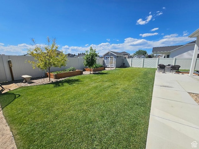 826 S 300 W, Vernal, UT 84078 - fenced backyard with a garden, a patio, and a storage unit