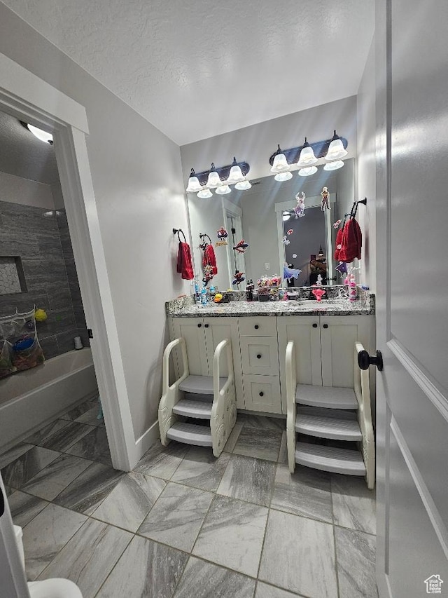 826 S 300 W, Vernal, UT 84078 - full bathroom featuring marble finish flooring, double vanity, and a textured ceiling