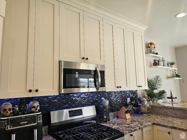 826 S 300 W, Vernal, UT 84078 - kitchen featuring appliances with stainless steel finishes, tasteful backsplash, open shelves, dark stone countertops, and recessed lighting