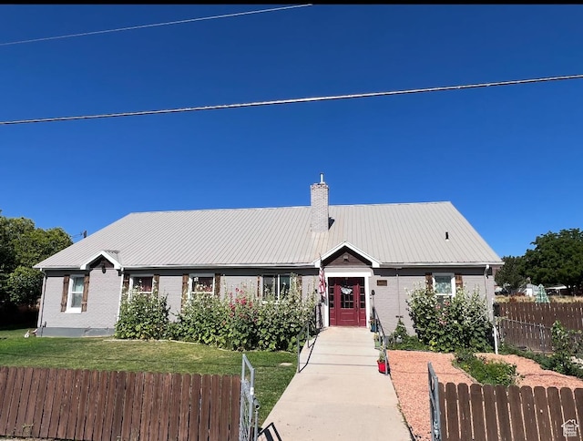 1375 N State St, Sigurd, UT 84657 - ranch-style home with a chimney, brick siding, and a metal roof