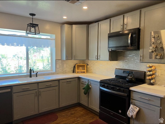 1375 N State St, Sigurd, UT 84657 - kitchen featuring stainless steel appliances, gray cabinets, light countertops, dark wood-style floors, and tasteful backsplash