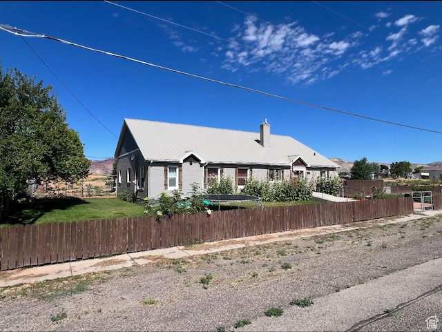 1375 N State St, Sigurd, UT 84657 - view of front of home with a chimney, a metal roof, and brick siding