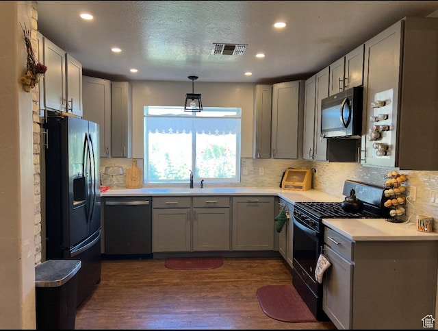 1375 N State St, Sigurd, UT 84657 - kitchen with black appliances, gray cabinets, dark wood-style flooring, decorative backsplash, and recessed lighting