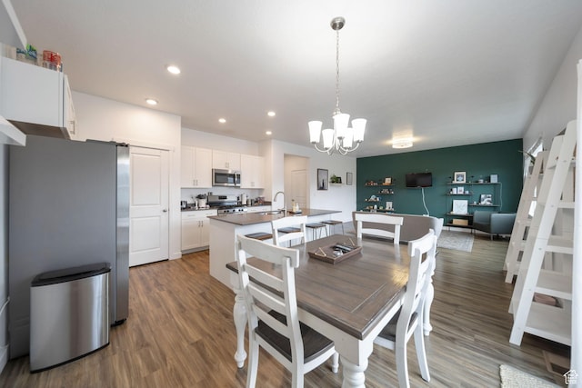 14837 S Messi St, Herriman, UT 84096 - dining area featuring a chandelier, recessed lighting, wood finished floors, and a barn door