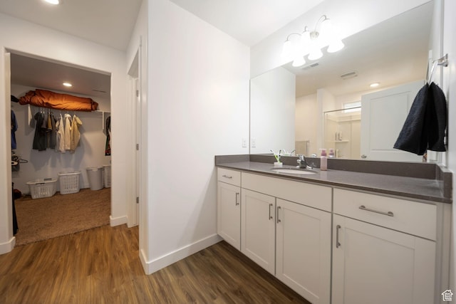 14837 S Messi St, Herriman, UT 84096 - full bathroom featuring vanity, a spacious closet, and wood finished floors