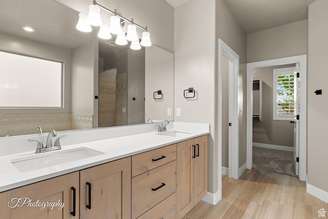 2762 E Hazel Dr, St George, UT 84790 - bathroom featuring double vanity and a tile shower