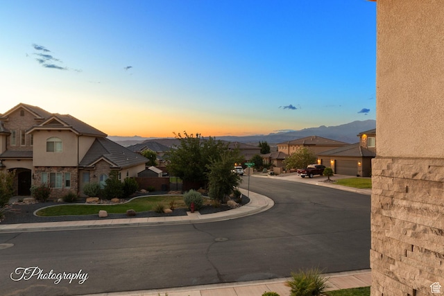 2762 E Hazel Dr, St George, UT 84790 - view of asphalt street featuring sidewalks, curbs, a mountain view, and a residential view