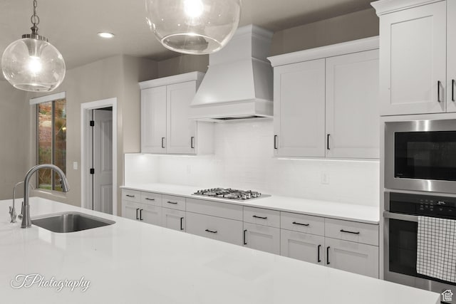 2762 E Hazel Dr, St George, UT 84790 - kitchen with premium range hood, light countertops, gas cooktop, white cabinets, and recessed lighting