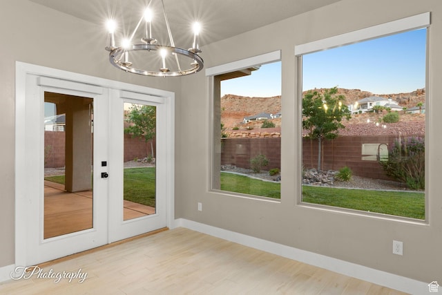 2762 E Hazel Dr, St George, UT 84790 - doorway with a chandelier, french doors, wood finished floors, and a mountain view