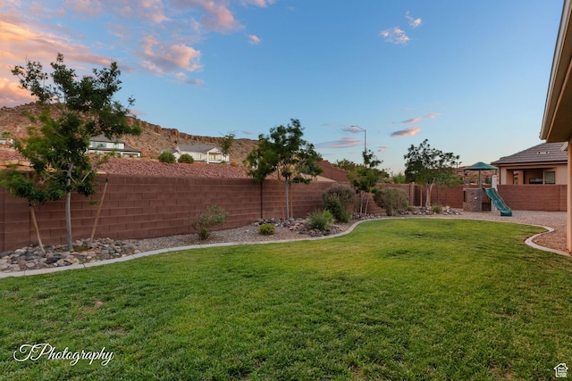 2762 E Hazel Dr, St George, UT 84790 - fenced backyard with a playground