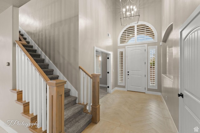 2762 E Hazel Dr, St George, UT 84790 - entryway with stairs, a chandelier, and a towering ceiling