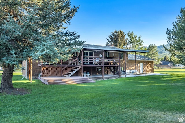 4918 E 2800 N, Eden, UT 84310 - back of house with a deck, a patio, stairs, a lawn, and a chimney
