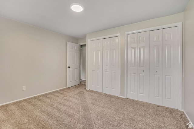 4918 E 2800 N, Eden, UT 84310 - unfurnished bedroom featuring carpet flooring and two closets