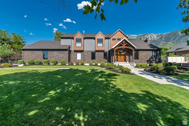22 S Sunwood Ln, Sandy, UT 84092 - view of front of property featuring brick siding, a chimney, and a mountain view