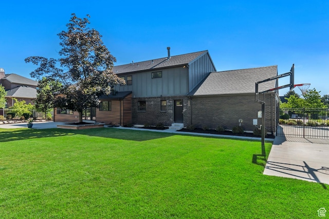 22 S Sunwood Ln, Sandy, UT 84092 - back of property featuring board and batten siding, brick siding, and roof with shingles