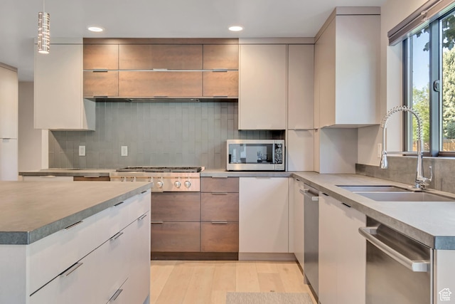 22 S Sunwood Ln, Sandy, UT 84092 - kitchen with appliances with stainless steel finishes, backsplash, recessed lighting, modern cabinets, and light countertops