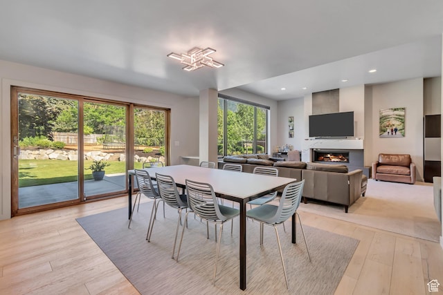 22 S Sunwood Ln, Sandy, UT 84092 - dining room featuring light wood-style floors, a large fireplace, and recessed lighting