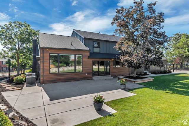 22 S Sunwood Ln, Sandy, UT 84092 - back of house featuring a patio, roof with shingles, and board and batten siding