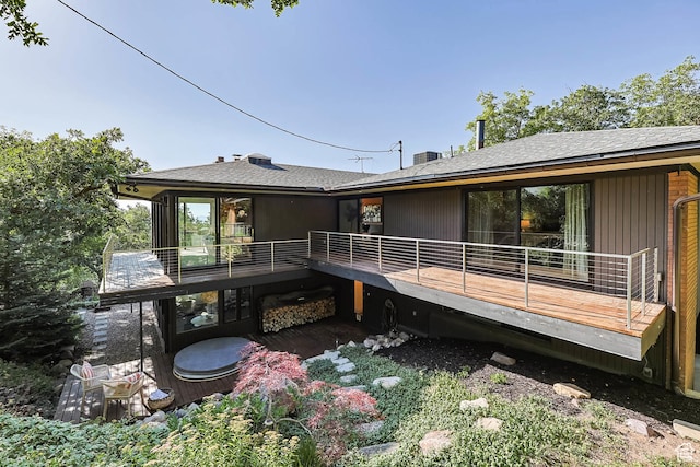 4352 S Zarahemla Dr, Salt Lake City, UT 84124 - back of property featuring a deck and roof with shingles