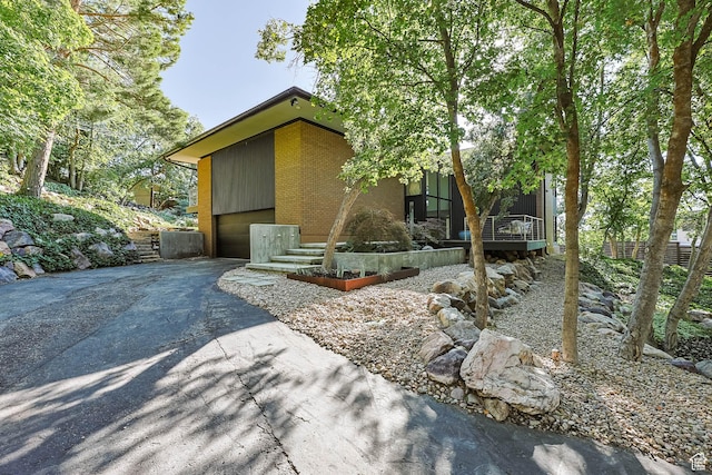 4352 S Zarahemla Dr, Salt Lake City, UT 84124 - view of front of property with asphalt driveway and a garage