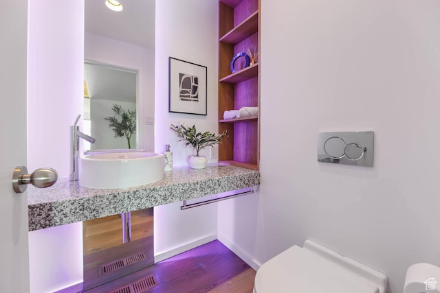 4352 S Zarahemla Dr, Salt Lake City, UT 84124 - half bathroom with toilet and wood finished floors