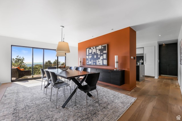 4352 S Zarahemla Dr, Salt Lake City, UT 84124 - dining space with light wood-style flooring and baseboards