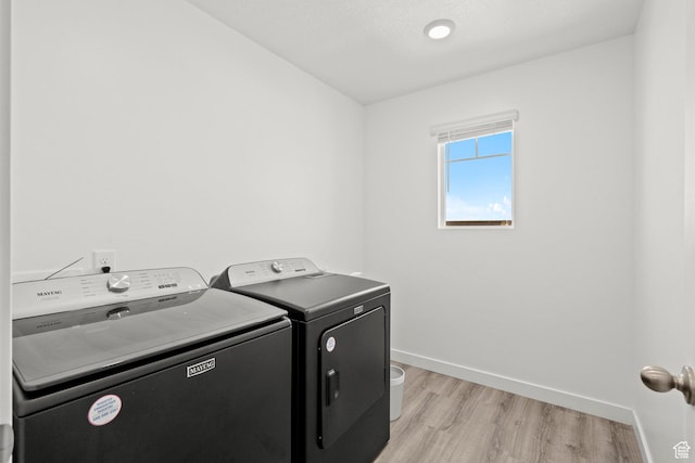 1017 S Red Cliff Dr, Santaquin, UT 84655 - washroom with separate washer and dryer and light wood-style flooring