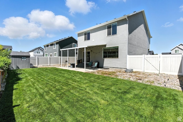 1017 S Red Cliff Dr, Santaquin, UT 84655 - rear view of house with a patio, a shed, a fenced backyard, and stucco siding